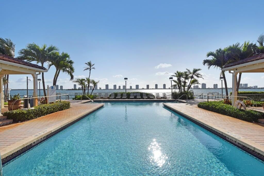 Photo of 1030 Lake Shore Drive #202, Lake Park, FL 33403 (MLS # R11030951)