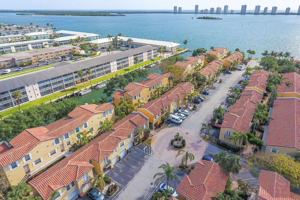 Photo of 1030 Lake Shore Drive #202, Lake Park, FL 33403 (MLS # R11030951)