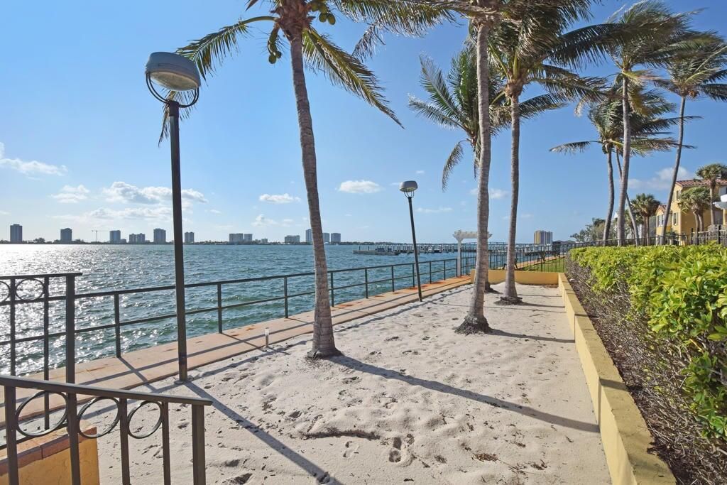 Photo of 1030 Lake Shore Drive #202, Lake Park, FL 33403 (MLS # R11030951)