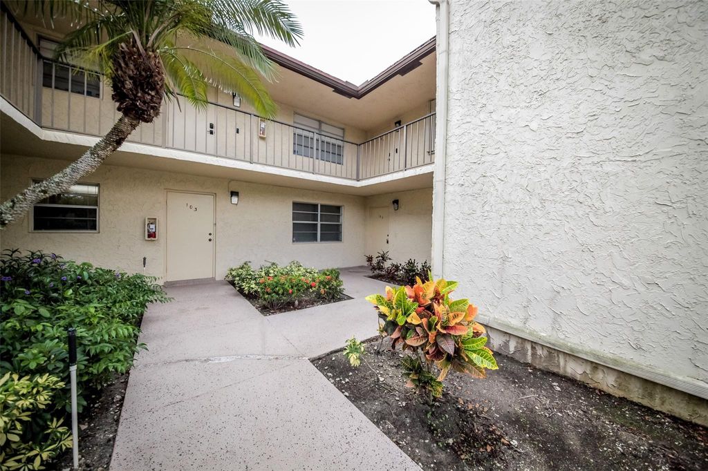Photo of 8760 Holly Court #104, Tamarac, FL 33321 (MLS # B26031380)