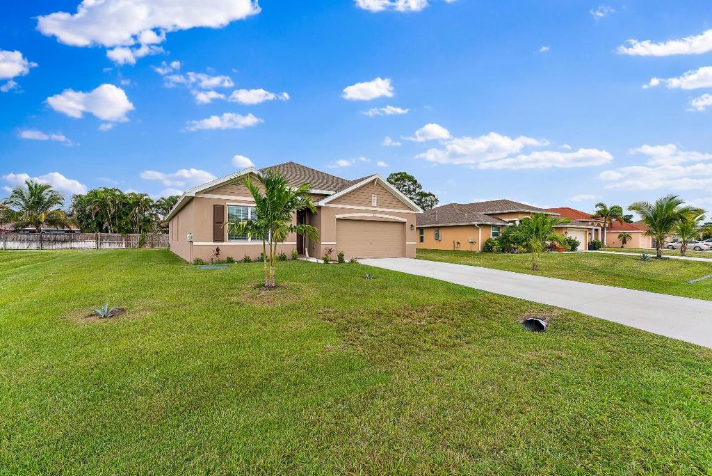 Photo of 1771 SW Lofgren Avenue, Port Saint Lucie, FL 34953 (MLS # R10947709)