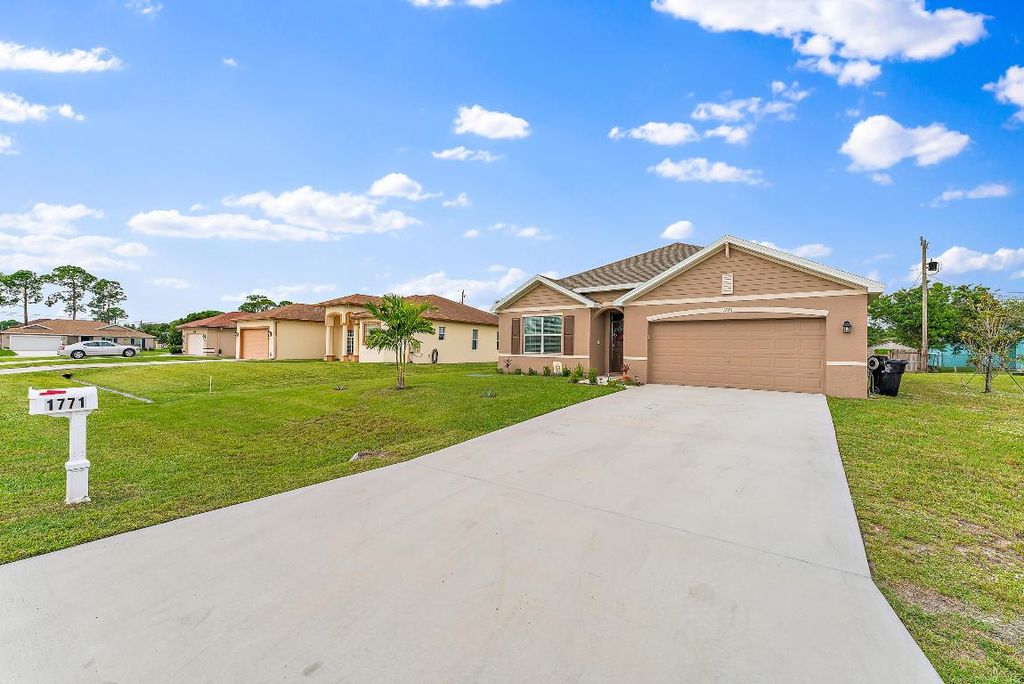 Photo of 1771 SW Lofgren Avenue, Port Saint Lucie, FL 34953 (MLS # R10947709)