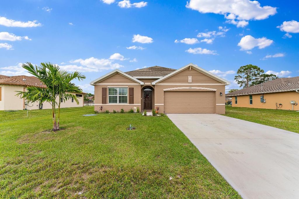 Photo of 1771 SW Lofgren Avenue, Port Saint Lucie, FL 34953 (MLS # R10947709)