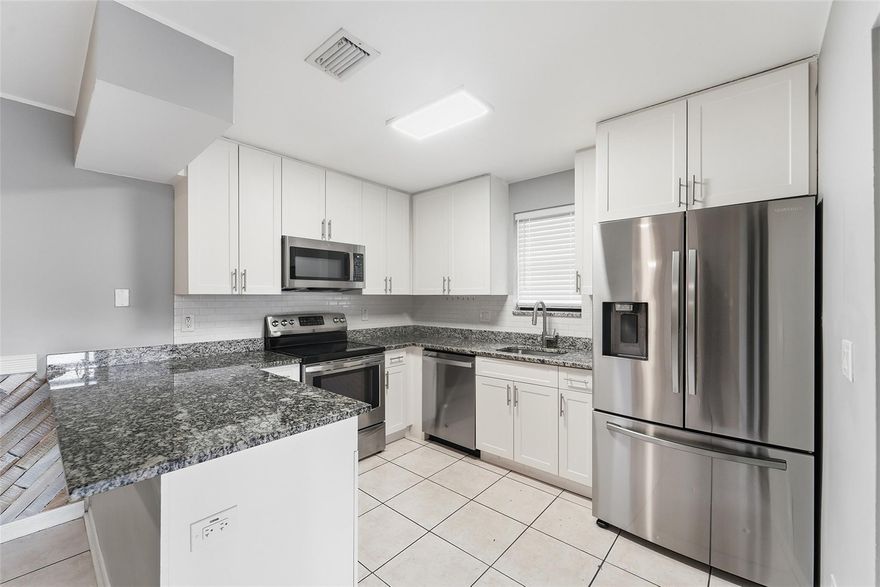 Open concept, breakfast bar and MODERN QUARTZ countertops, WHITE SHAKER cabinets, downstairs laundry with full size appliances and half bath.  All bedrooms, including a spacious master, are on the second floor. Huge private fenced patio for entertaining or kids to play in. "A" schools.  HOA fee includes water, exterior insurance & roof repair! Close to Mullins Park, shopping, restaurants, mall, highways. 2 DOGS under 40 lbs OK!