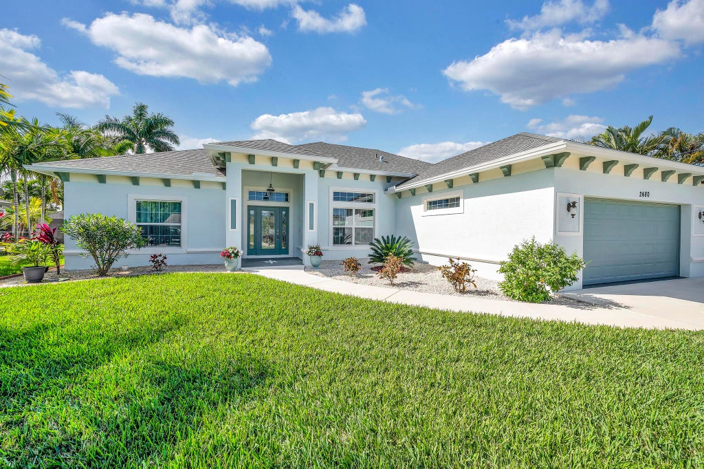 Photo of 2480 SE Marius Street, Port Saint Lucie, FL 34952 (MLS # R11004379)