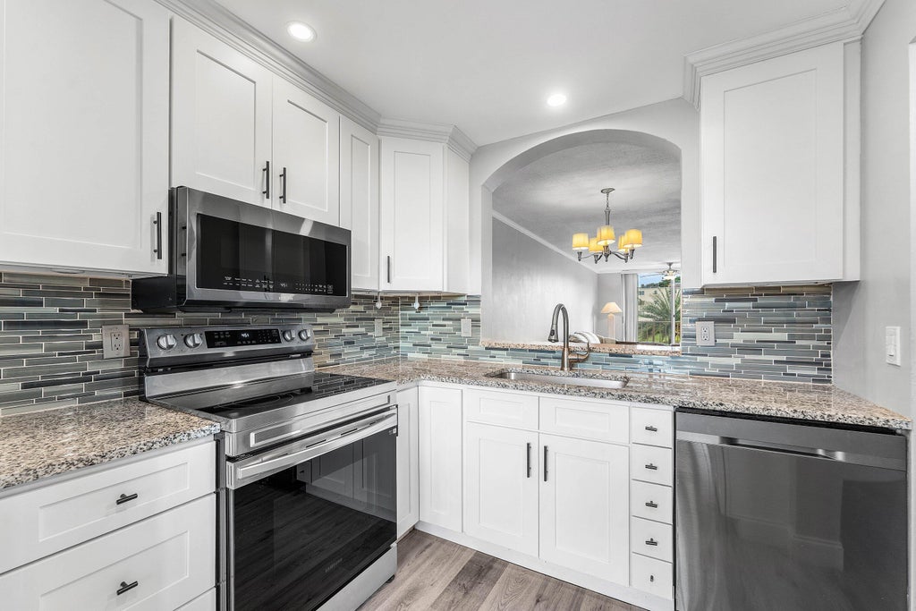 Photo of 14307 BEDFORD Drive #204, Delray Beach, FL 33446 (MLS # B26071353)
