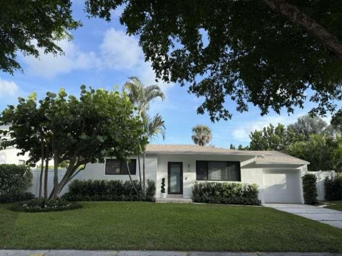 Beautiful Mid-Century home in Trendy SoSo section of West Palm Beach three blocks from intercoastal waterway. Recently remodeled by a luxury builder. This 3 Bedroom/ 2 1/2 Bath is Turn-Key, ready to entertain in the private backyard. Everything new-Impact windows and doors, 200 Amp Electrical service-wires undergrounded, new kitchen addition/laundry room, new baths, roof, AC, security system with camera, newly painted interior and exterior, new salt water filtration pool, shell-stone deck, new driveway, fencing,and all new landscaping with irrigation system. One car garage. Minutes to Worth Ave and the airport.