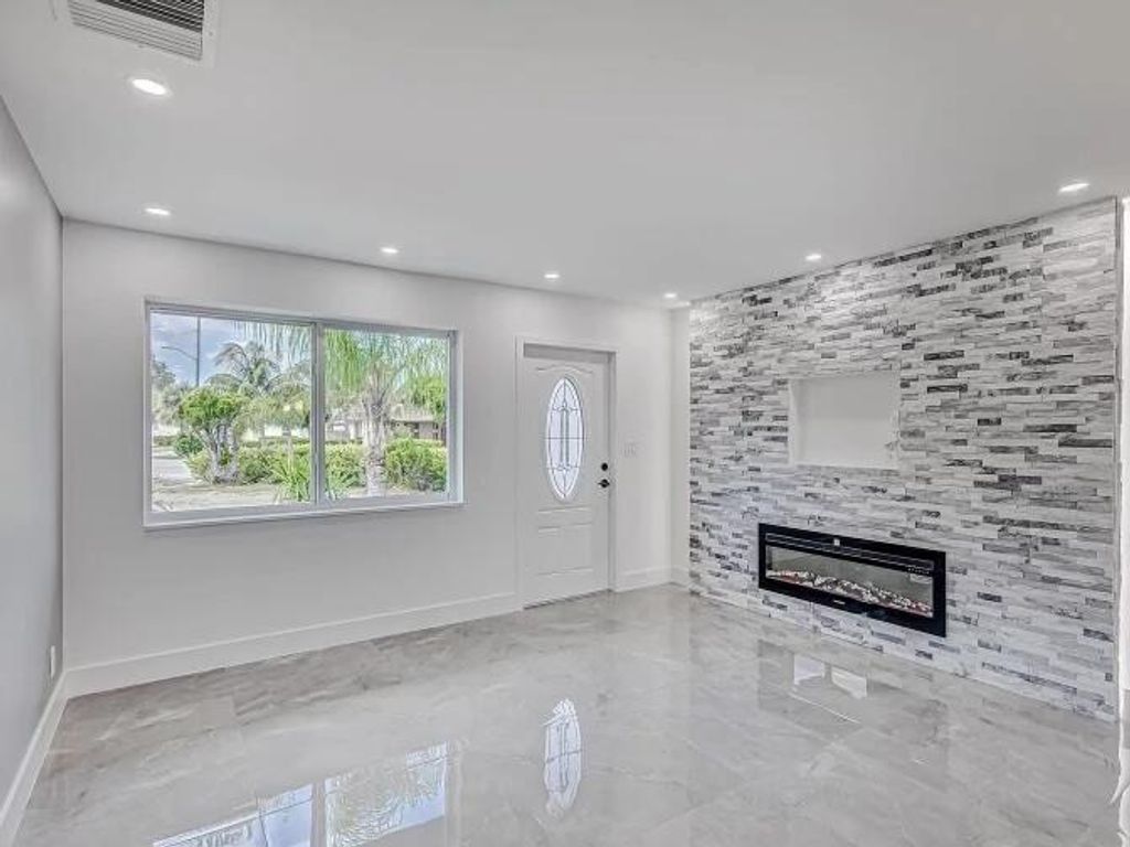 Photo of 855 Date Palm Drive, Lake Park, FL 33403 (MLS # R11167145)