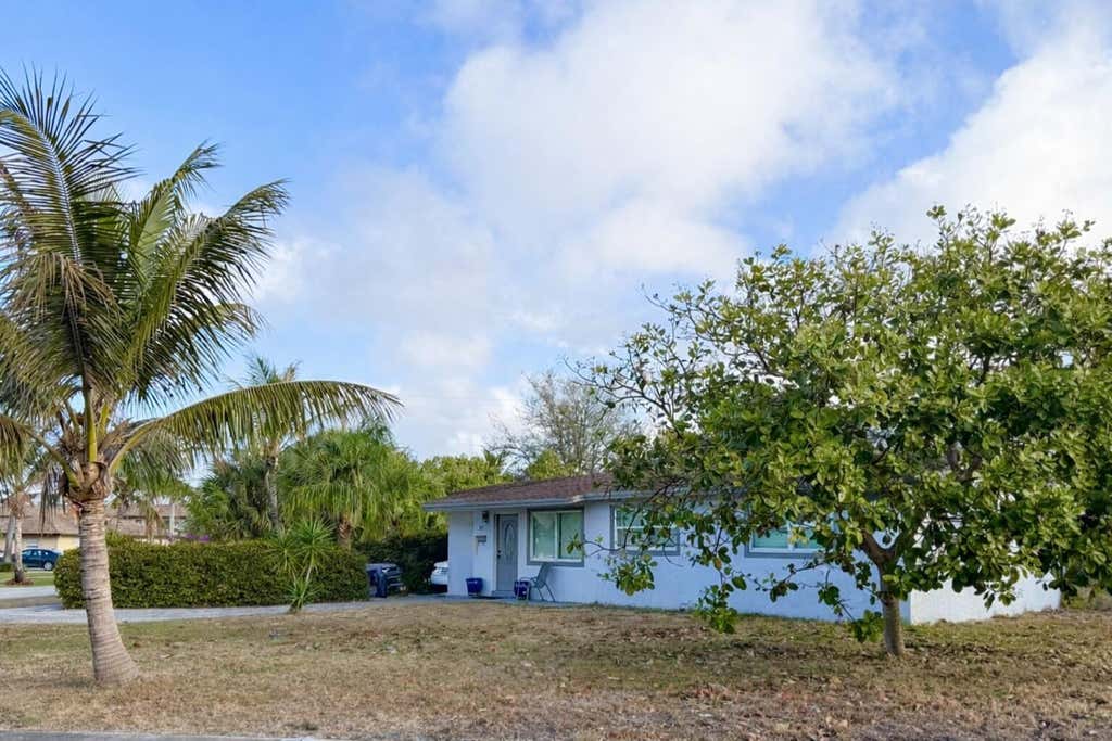 Photo of 855 Date Palm Drive, Lake Park, FL 33403 (MLS # R11167145)
