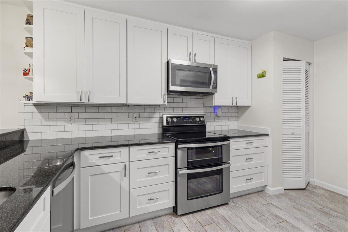 This beautifully updated 2/2 home with a large loft (that can easily work as a third bedroom) is light, bright and open with wood-look tile flooring throughout the main floor, brand new carpet on the stairs, and laminate flooring upstairs. The kitchen features white shaker cabinets, a clean subway tile backsplash, granite counters with plenty of counterspace, and stainless-steel appliances. Both bathrooms have been nicely updated. Impact windows and sliders throughout for peace of mind. Washer and dryer in the unit. Enjoy your morning coffee or afternoon BBQs in the screened in patio. Community is for all ages and is conveniently located near two golf courses, Pioneer Park, Botanical Gardens, restaurants, shopping and more!