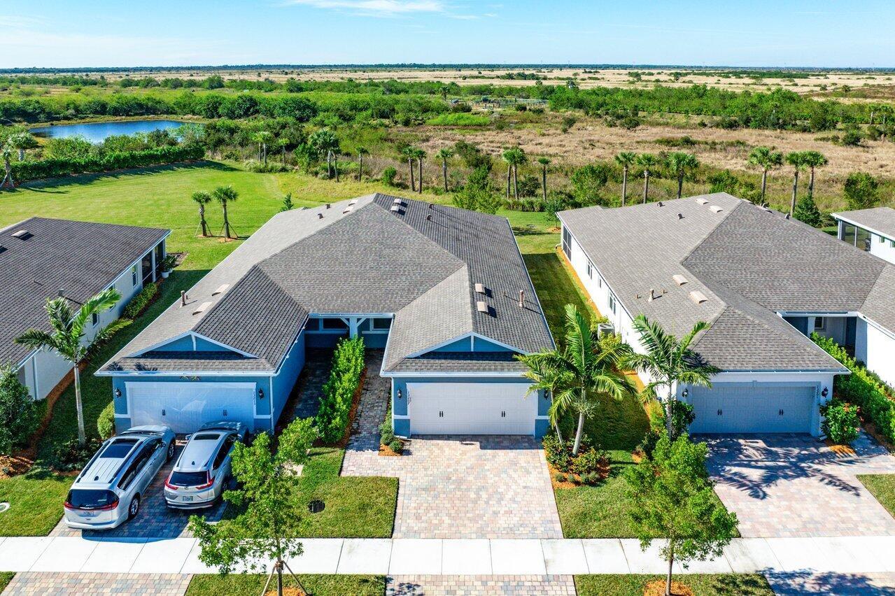 Discover this beautifully designed 2-bedroom, 2-bathroom CBS villa featuring a versatile flex room and a 2-car garage, perfectly situated on a serene preserve lot in the highly sought-after, gated 55+ community of Del Webb at Traditions. Built in 2022, this home offers a spacious open floor plan with modern upgrades throughout, including a flex room that can easily serve as a third bedroom, home office, den, or hobby room--offering the perfect solution for any lifestyle.Step inside to find durable faux-wood tile flooring flowing seamlessly through the entire home. The gourmet kitchen boasts 42'' soft-close cabinetry, a large center island, granite countertops, a gas stove, tiled backsplash, and stainless-steel Whirlpool appliances--perfect for cooking and entertaining.