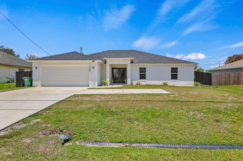 Photo of 1049 SW Paar Drive, Port Saint Lucie, FL 34953 (MLS # B26036807)