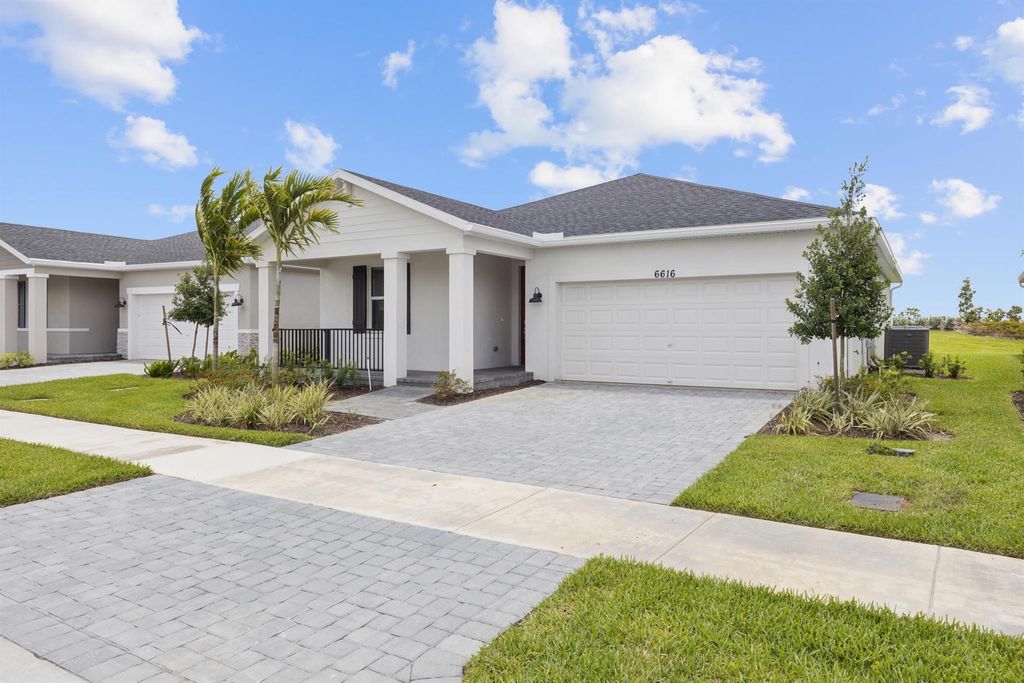 Photo of 6616 NW Cloverdale Avenue, Port Saint Lucie, FL 34987 (MLS # R11106068)