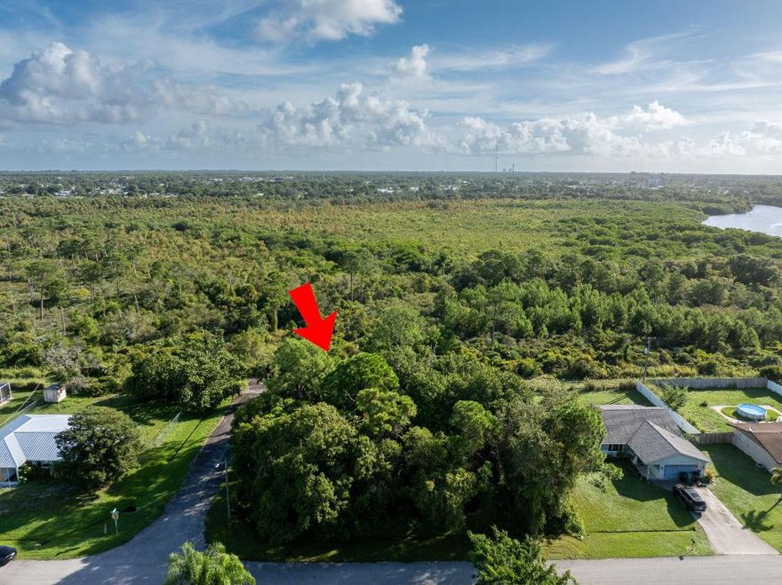 Don't miss your opportunity to build your dream home on this one-of-kind lot in central Port St Lucie. If you have been looking for tranquility but still want to be close to modern conveniences, this is it! This .35 acre corner lot is located in a quiet neighborhood with only two points of entry which means limited traffic and a greater sense of privacy. Enjoy the view of the unspoiled Florida preserve right in your own backyard. This preserve is home to many of Florida's indigenous flora and fauna, ideal for any nature enthusiast. It also backs up to the St Lucie River, with the River Park Marina just 1.5 miles away. You are also close to shopping and restaurants, and less than 6 miles from the highway - great for commuters! Builder recommendations available on request.