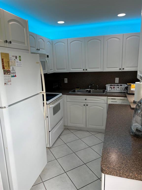 First floor corner near pool and clubhouse. Impact glass sunroom and tile flooring.