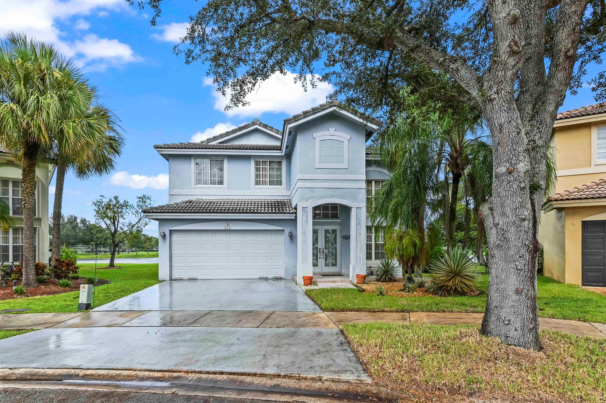 Welcome to an exclusive waterfront property, perfectly situated on a unique peninsula lot where your home is virtually surrounded by water. This stunning two-story residence boasts one of the most premier settings in the community, providing spectacular, expansive lake views from nearly every window. This is a truly rare opportunity to own a piece of waterfront paradise where tranquility and privacy are paramount.