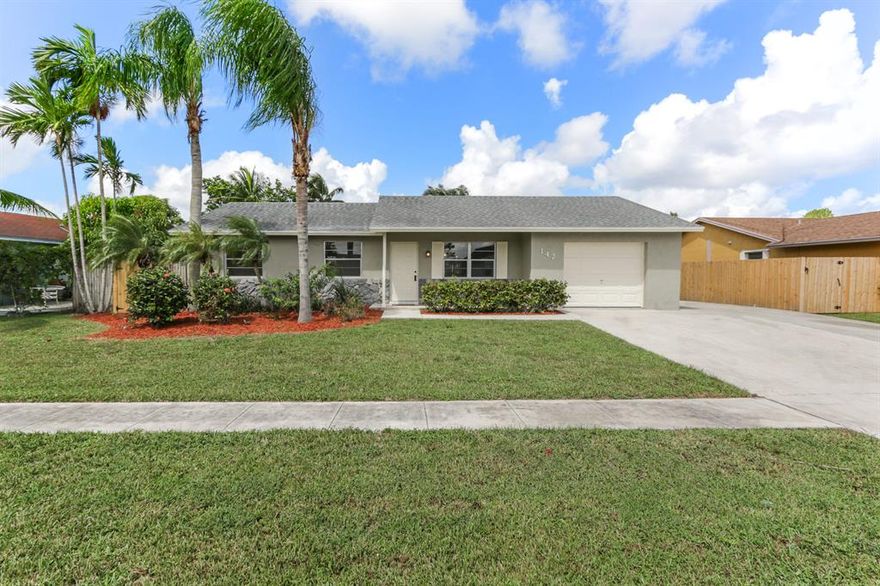 Updated 3 bedrooms, 2 full bathrooms, 1 car garage pool home with a beautiful canal view.  Enclosed patio area with a/c.  Updates include brand new kitchen cabinets, granite counter tops, new laminate wood floors in living area, new tile in kitchen, new carpet in bedrooms, new light fixtures and hardware through out, and fresh interior and exterior paint.   No HOA.