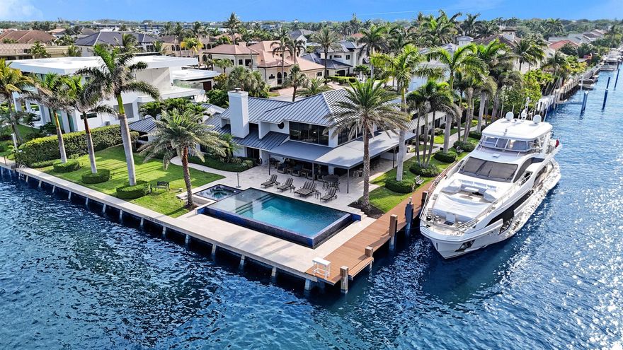 Direct Intracoastal Point Lot! Experience unparalleled waterfront living at 961 Iris Drive, a modern contemporary estate nestled on a rare Intracoastal point lot in Delray Beach's exclusive Tropic Isle community. Boasting 310 feet of deep-water frontage including 185 feet along a side canal this fully furnished residence is a yachtsman's dream, accommodating vessels up to 150 feet with no fixed bridges to the ocean.Inside, the home features a striking floating staircase, 9-foot solid core doors, and a master suite that exudes timeless charm. The versatile garage is newly refinished and air-conditioned, ideal for various uses. Top-of-the-line appliances from Sub-Zero, GE Monogram, and Miele are in impeccable condition, complemented by a 30 kW