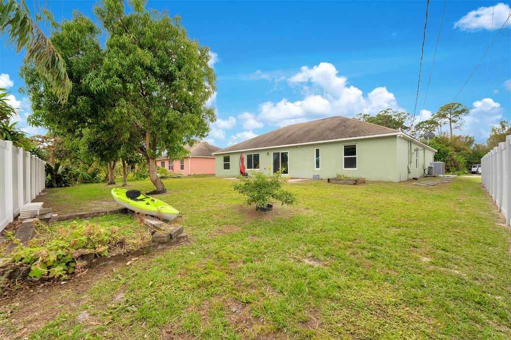 Photo of 1231 SE Naples Lane, Port Saint Lucie, FL 34983 (MLS # R11052379)