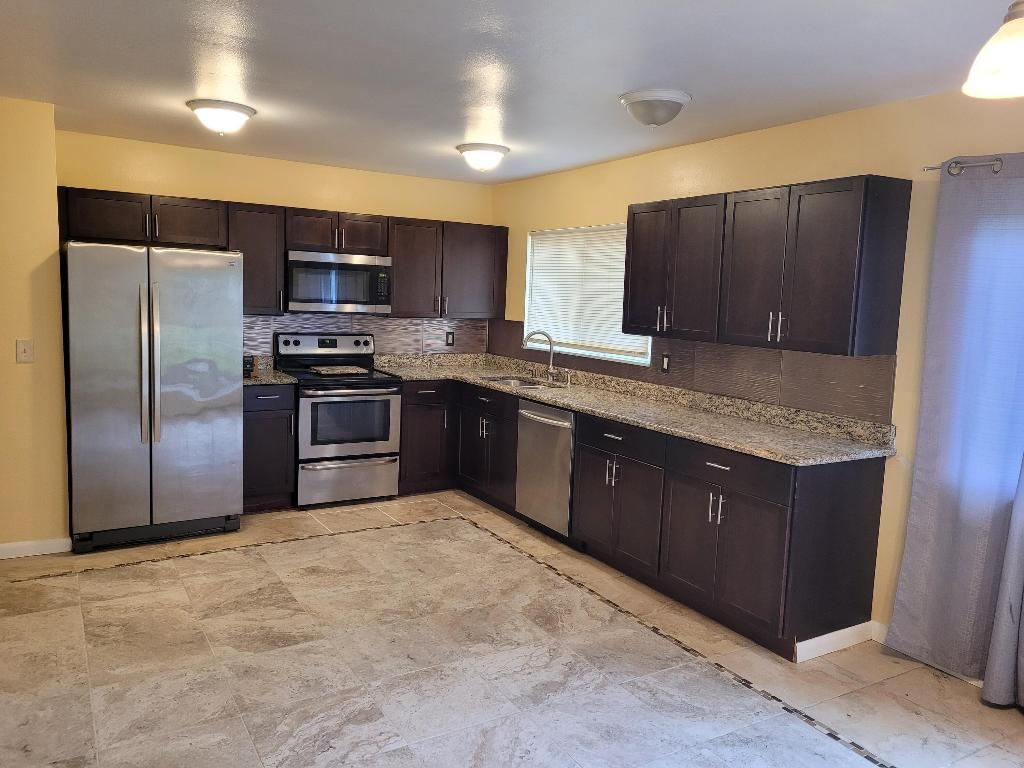 Photo of 413 SW Kentwood Road, Port Saint Lucie, FL 34953 (MLS # R10950706)