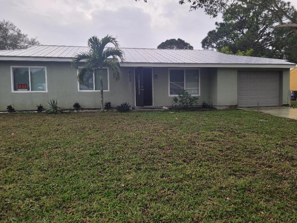 Photo of 413 SW Kentwood Road, Port Saint Lucie, FL 34953 (MLS # R10950706)