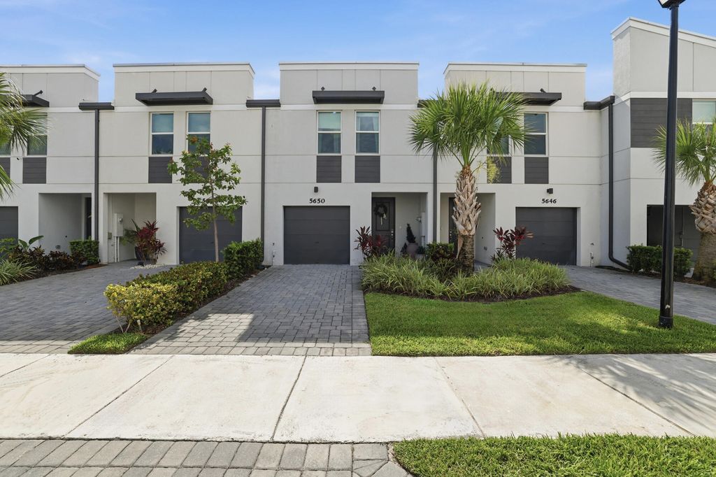 Photo of 5650 Enclave Drive, Mangonia Park, FL 33407 (MLS # B26052942)