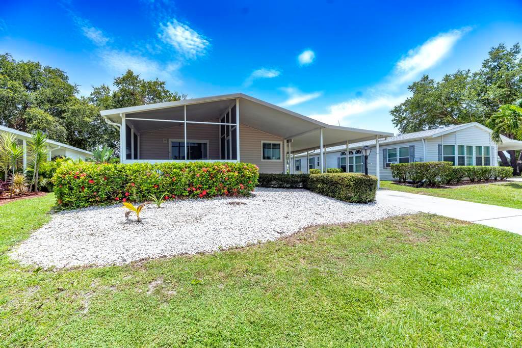 Updated and well-maintained 2BR, 2BA home in the 55+ Active Community of Savanna Club! Features include a renovated kitchen with white wood cabinets, granite countertops, tiled backsplash, and black stainless appliances (all 3 years old), plus new wood laminate flooring throughout. Enjoy vaulted ceilings, an open floor plan, and a covered, screened front patio with tiled floors. Interior laundry, attached storage shed with electric. Resort-style community offers internet, cable, and a wide range of amenities and activities to enjoy the 55+ lifestyle! Call today for a private tour.