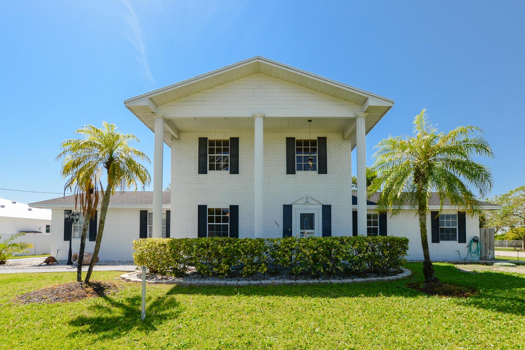 Fabulous 2 story Colonial Pool home custom built with lovely corner lot. Features 3 Bedrooms, 3 Baths, Oversized 2 Car garage & beautiful screen enclosed pool & spa. Boasting 2 Large Primary Ensuite's upstairs with one offering balcony, pool & water view. One bedroom downstairs with two closets and full bathroom. Spacious kitchen with large pantry, granite counter tops and breakfast area. Laundry room and utility closet. New roof 2019. New insulation in attic space. New grinder for sewer system and zone sprinkler system on a well. Great neighborhood close to schools, shopping, golf and beaches!