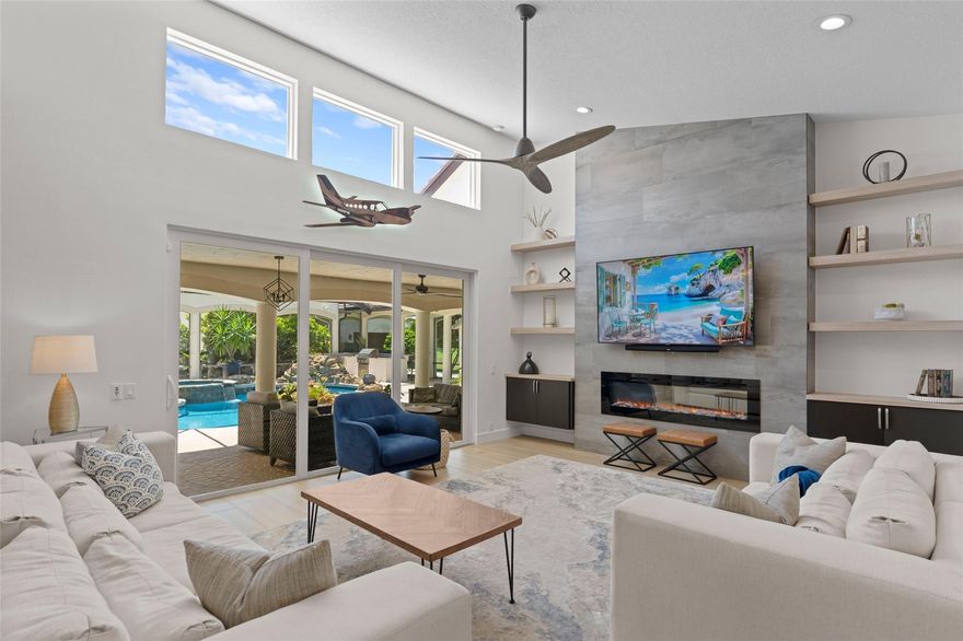 Experience the ultimate blend of luxury & aviation lifestyle in this stunningly remodeled 5b/3b home + bonus room/office, perfectly situated on a taxiway in the aviation community of Wellington Aero Club. Enter via a pavered circular drive lined with Sylvester date palms, to 3,621 sqft of elegant living space and a large 2,000 sqft detached CBS aircraft hangar. This property offers direct access to a 4,000 ft paved & lit runway. Golf cart distance from world-renowned equestrian shows, walking trails, and bike paths, making this an exceptional retreat for aviation, equestrian, and outdoor enthusiasts. All impact windows and doors. Newer roof & AC units. Enjoy fresh fruit from mature mango, avocado, loquat, & banana trees. Municipal water. Heated pool & spa. Hangar: 40'x50', Door: 46' x 12'.