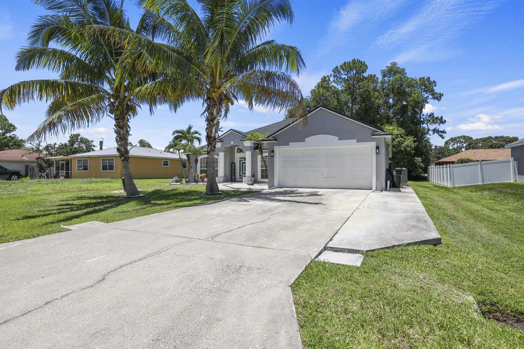 Photo of 421 NW Cornell Avenue, Port Saint Lucie, FL 34983 (MLS # R11101101)