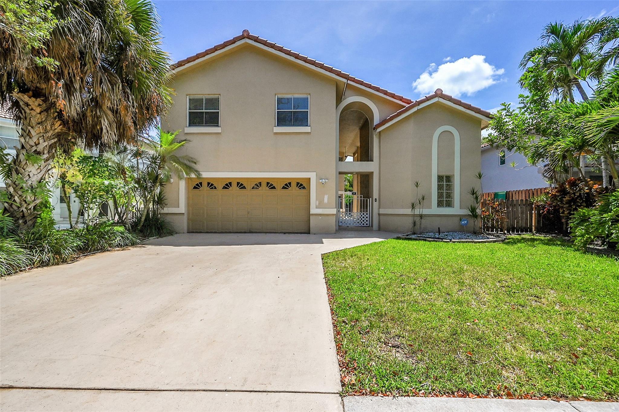 Impressive single family 5 bedroom 3 bathroom, courtyard model home features a tropical oasis with a large pool, serene water view and open court yard design ideal for entertaining and outdoor activities. Offers a private, detached In Law Suite perfect for hosting guests or relatives. The interior of the home features an updated modern white kitchen with stainless appliances, quartz counter tops. Time to make culinary masterpieces! Grand double door entry way with high ceilings allowing much natural light. Spacious Master bedroom with walk in closet, dual sink design, whirlpool bathtub, and glass frameless shower. Great location with top schools, near parks, close to shopping and major highways. Ideal location in a lovely, gated community.
