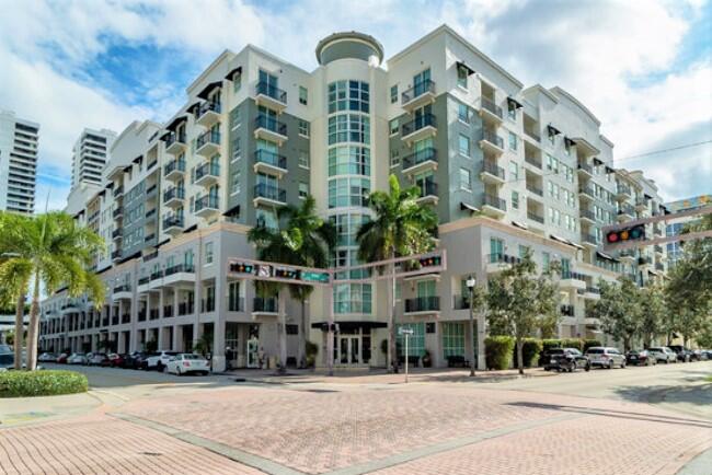 1BR + Den in the heart of downtown WPB! Granite counters and stainless appliances in kitchen, full-size W/D in unit, large closet in BR, carpet in LR and BR, covered balcony. Den is nice size for a home office. Building amenities include 24hr front desk, pool, hot tub, fitness studio, sauna, social room. Assigned parking space is steps from the unit! Walk to shopping, dining, entertainment, and the waterfront. Trolley stop nearby. 1 pet up to 15lbs ok with $250 non-refundable pet fee. Unfurnished, annual lease only. Tenant pays electric, cable, internet. Parking space is conveniently located on same floor as unit - just steps from your front door!