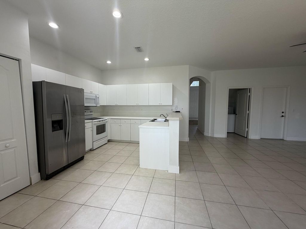 Photo of 148 Seminole Lakes Drive, Royal Palm Beach, FL 33411 (MLS # B26002930)