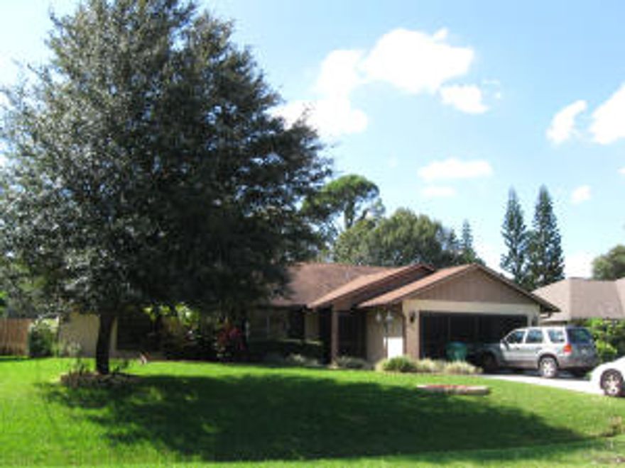 Showings start Monday November 3. Lush green lawn with mature trees and in ground sprinkler system.  Sits near St. Lucie West and offers so many extras. In ground 24 x 12 pool w heater and w screened enclosure. Cathedral ceilings, Gorgeous Newer kitchen with cherry wood cabinets with quiet drawer close technology, granite counter tops that extend out to porch and crown moulding a top the kitchen cabinets.  12 foot windowed wall that looks out from kitchen onto porch. Window wall features the ''see past the corner'' Huge Porch 34 x 11 with french doors and 2 sets of sliders. Year round porch.  Split bedroom plan and all bedrooms have walk in closets. Master Bedroom has set of french doors opening onto porch. Master has over sized wic closet 13 x 6 and also have LG master bath C add'l remark