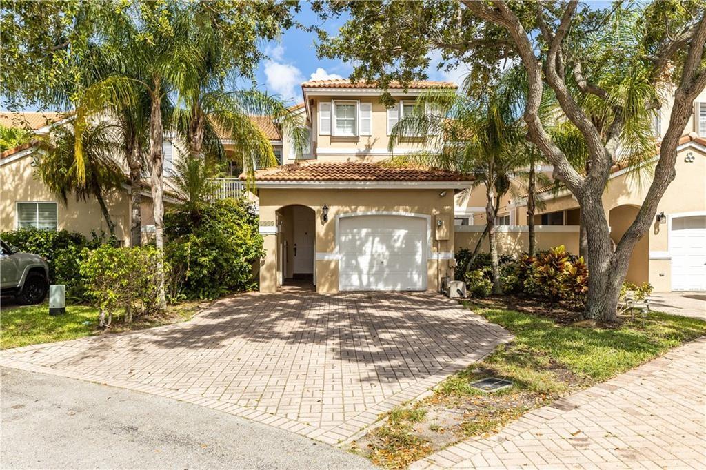 THIS 3/2.5 TOWNHOUSE WITH 1 CAR GARAGE IS AN ABSOLUTE MUST SEE!! COMPLETELY REMODELED FROM TOP TO BOTTOM. NEW ROOF, AMAZING ISLAND KITCHEN THAT HAS BEEN OPENED UP TO THE LIVING AND DINING AREAS. BEAUTIFUL QUARTZ COUNTER TOPS, DESIGNER CUSTOM CABINETS, SAMSUNG STAINLESS STEEL APPLIANCES INCLUDING WASHER/DRYER. DESIGNER FIXTURES WILL STAY IN THE PROPERTY. SUBWAY TILE BACKSPLASH COMPLETES THE GORGEOUS LOOK OF THE KITCHEN. 36 X36 ITALIAN PORCELEIN FLOORS DOWNSTAIRS, WITH WOOD ON THE STAIRCASE THAT OFFERS A GLASS ENCLOSED RAILING. TILE FLOORS UPSTAIRS, ALL NEW LED LIGHTING THROUGHOUT. ALL BATHROOMS HAVE BEEN REMODELED. HURRICANE ACCORDION SHUTTERS, AND POPCORN CEILINGS HAVE BEEN REMOVED. WEST LAKE VILLAGE IS GUARD GATED 24/7 AND 1 MILE FROM THE OCEAN. AMENITIES INCL 4 TENNIS COURTS, GYM,