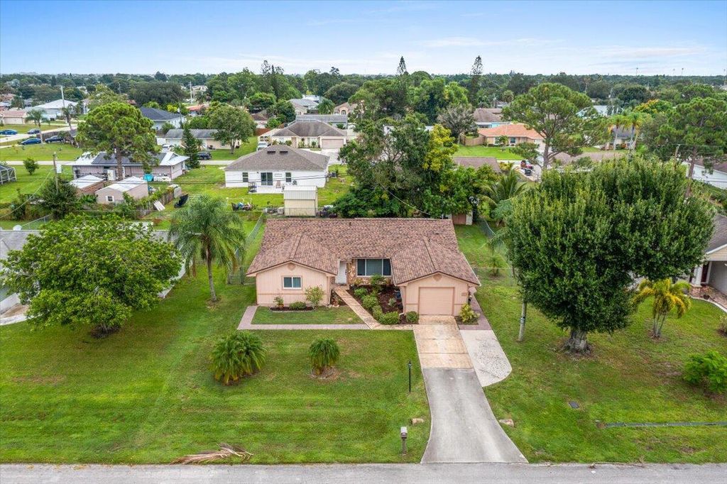 Photo of 357 NW Hogan Street, Port Saint Lucie, FL 34983 (MLS # R11015893)