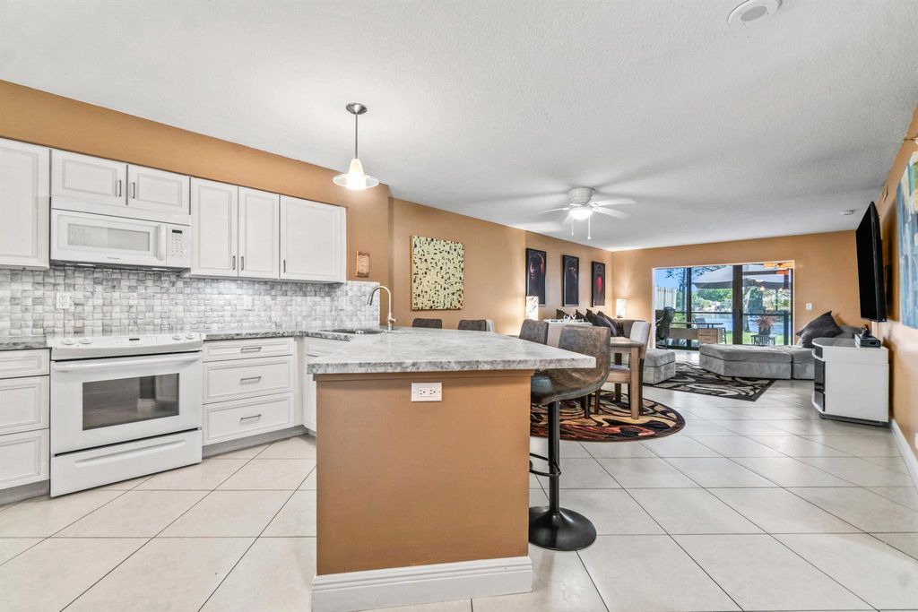 Photo of 2238 N Cypress Bend Drive #108, Pompano Beach, FL 33069 (MLS # R11049651)