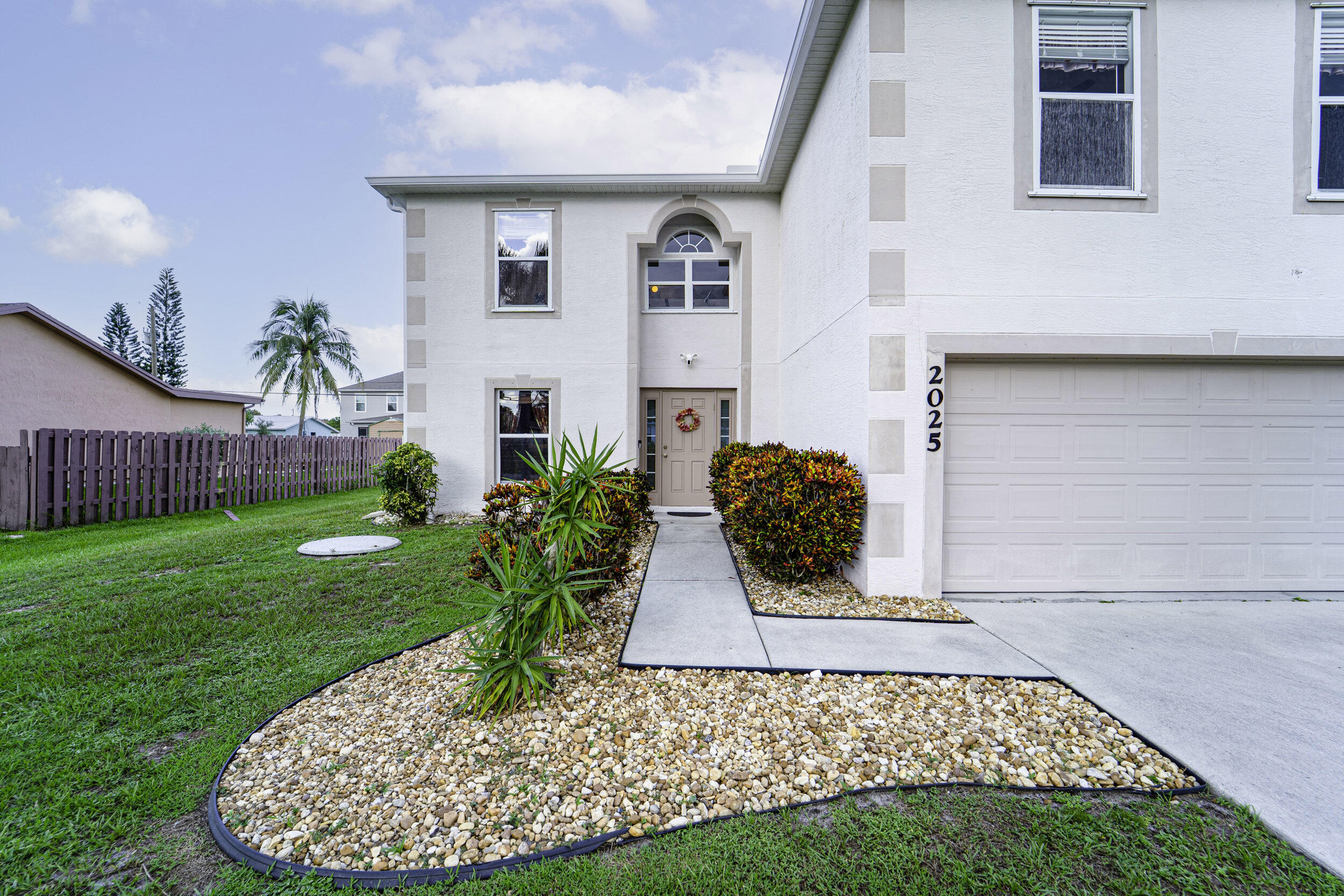 Come and see this beautiful 4-bedroom, 2.5-bathroom, 2-car garage two-story home in the heart of Port St. Lucie! This move-in ready home offers peace of mind with a brand-new roof and gutters, plus two A/C units, one recently replaced and the other in 2017. Step inside to a bright and inviting layout with spacious living areas that flow effortlessly, perfect for both everyday living and entertaining. The generously sized bedrooms provide comfort and privacy for the whole family, while the kitchen and dining spaces make gathering easy and enjoyable. Outside, the private backyard is ready for relaxation, weekend barbecues, or playtime with loved ones. Conveniently located near shopping, dining, schools, and major highways, this home combines comfort, practicality, and a family-friendly
