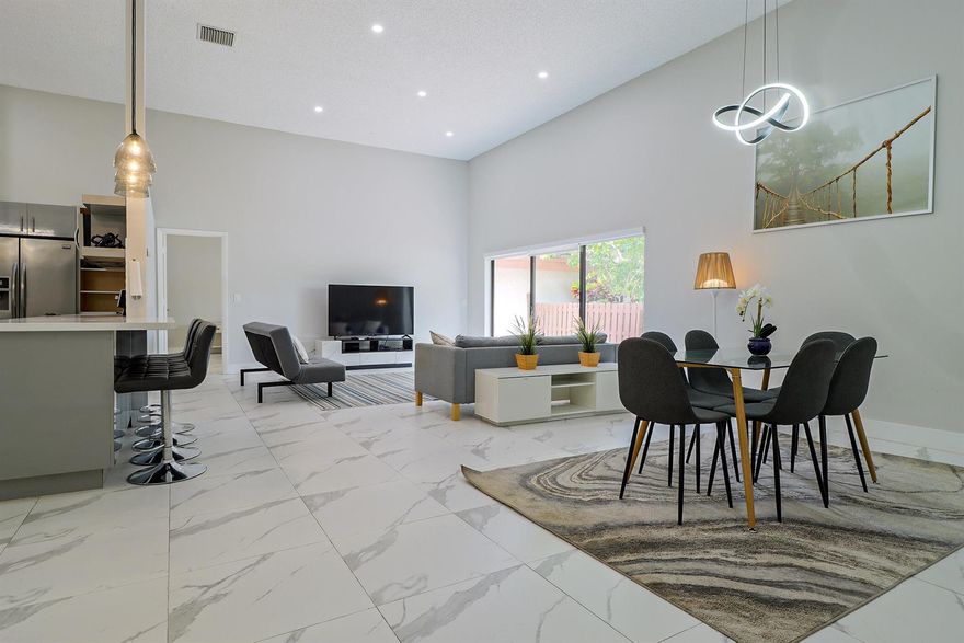 Based in the highly desirable boating community of Harbourwood Villas in Hallandale Beach, this fully renovated 3-bedroom, 2-bath villa blends modern design with coastal lifestyle. Just minutes from the beach, dining, shopping, golf, and Gulfstream Park Casino. It features an open, light-filled layout with sleek ceramic flooring, a stylish new kitchen, updated bathrooms, and all-new appliances. With two parking spaces, a private backyard with a fruit tree, and a charming walkway. The standout feature is a private boat dock and slip for up to a 45-foot vessel in the community marina, offering direct access to the Intracoastal and ocean. Offered fully furnished for turnkey convenience, with water and internet included in the HOA.  This is effortless, upscale living by the water. Negotiable!