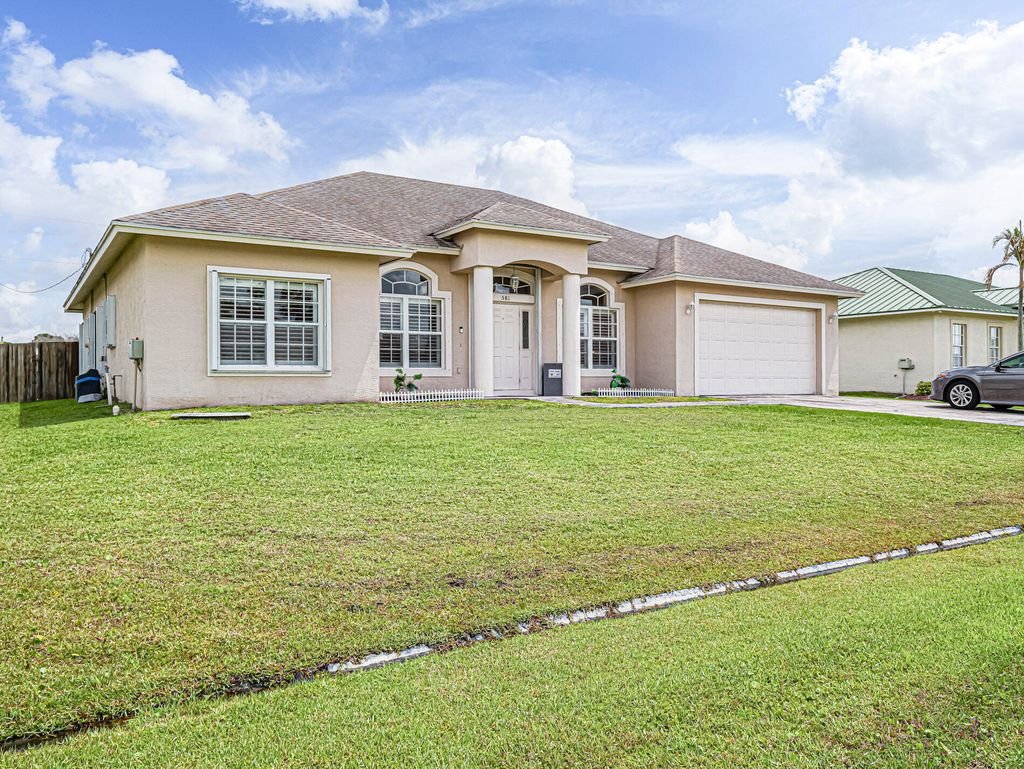 Photo of 581 SW Grove Avenue, Port Saint Lucie, FL 34983 (MLS # B26030618)