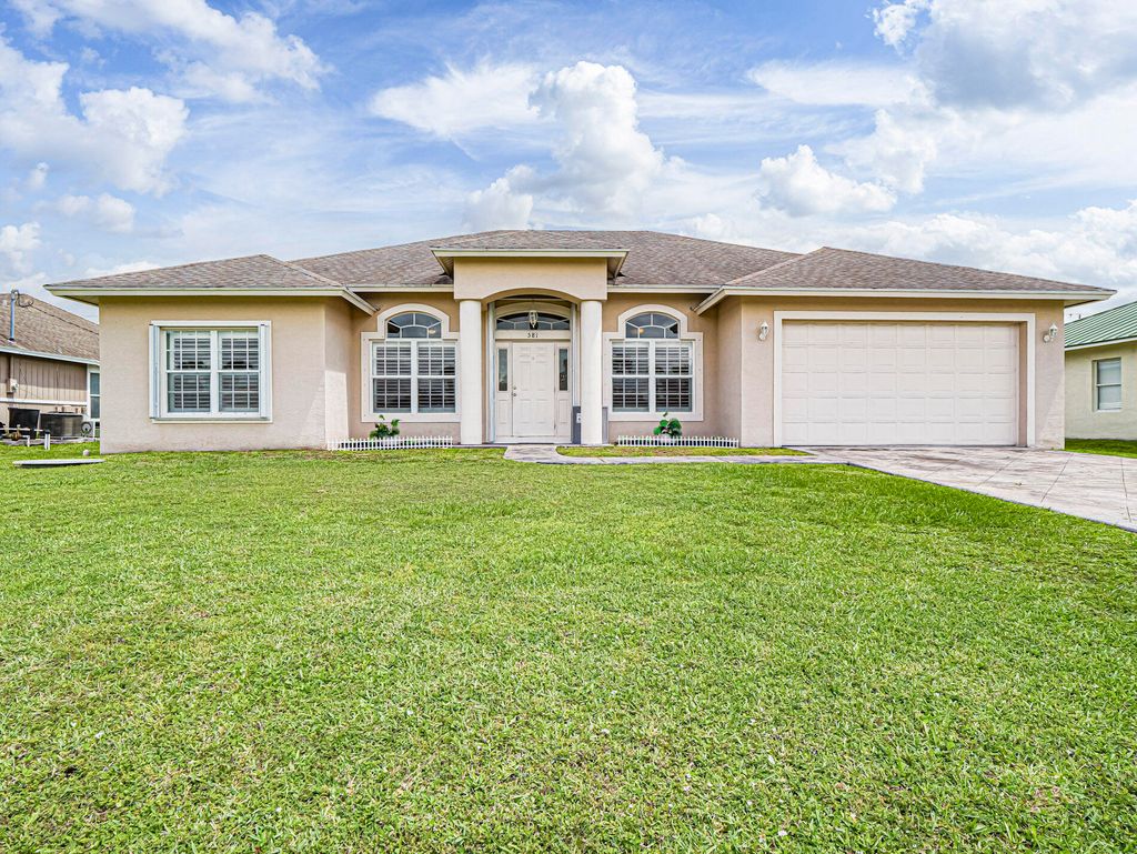 Photo of 581 SW Grove Avenue, Port Saint Lucie, FL 34983 (MLS # B26030618)