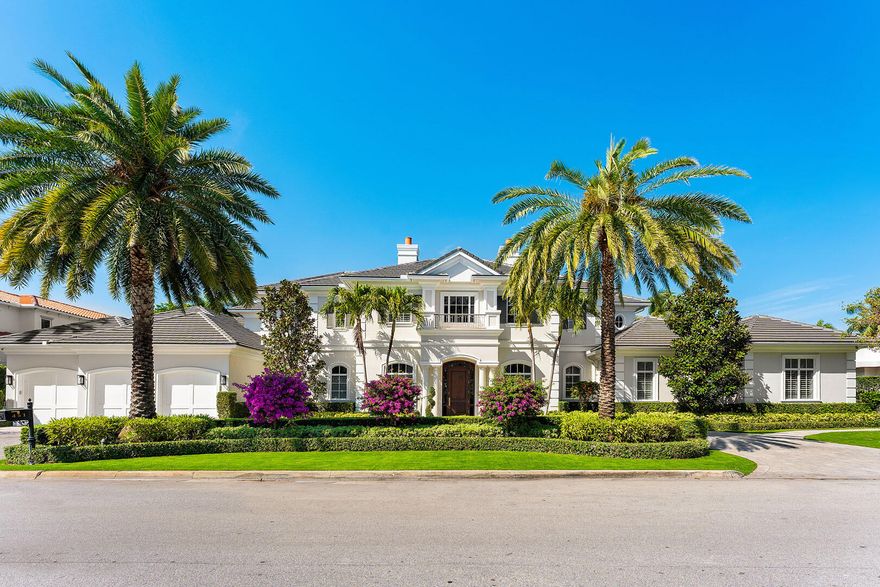 This exceptional estate at 461 South Maya Palm Drive spans one and two-thirds lots in Boca Raton's most prestigious Royal Palm Yacht & Country Club. Crafted by the esteemed SRD Building Corp. with design by the award-winning P&H Interiors, this home offers a remarkable blend of grandeur and comfort. A sprawling backyard with premium turf provides an ideal space for recreation and relaxing, while the tranquil location within the community ensures privacy.Designed for those who appreciate the best in Florida living, the outdoor areas feature both covered and open-air entertaining spaces, a summer kitchen, a heated pool and spa, a sports court, and lush tropical landscaping that enhances the estate's natural beauty. The first-floor primary suite is a private retreat,