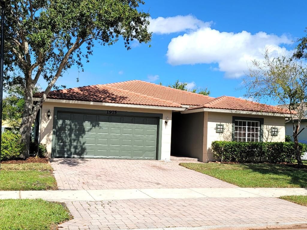 Photo of 1975 SW Jamesport Drive, Port Saint Lucie, FL 34953 (MLS # R10938088)