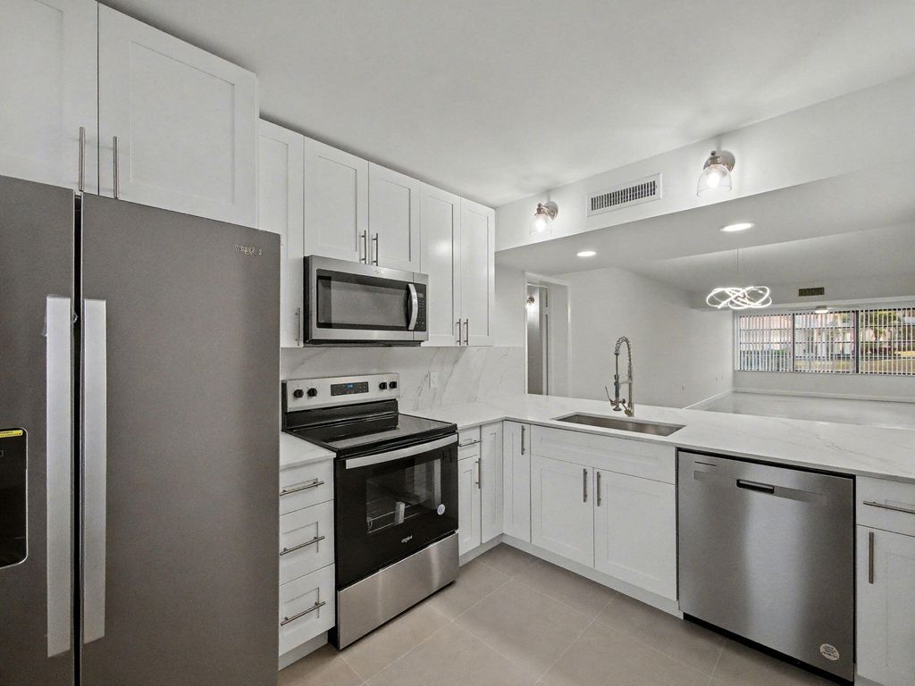 Photo of 3501 Village Blvd #Apt 104, West Palm Beach, FL 33409 (MLS # R11163002)