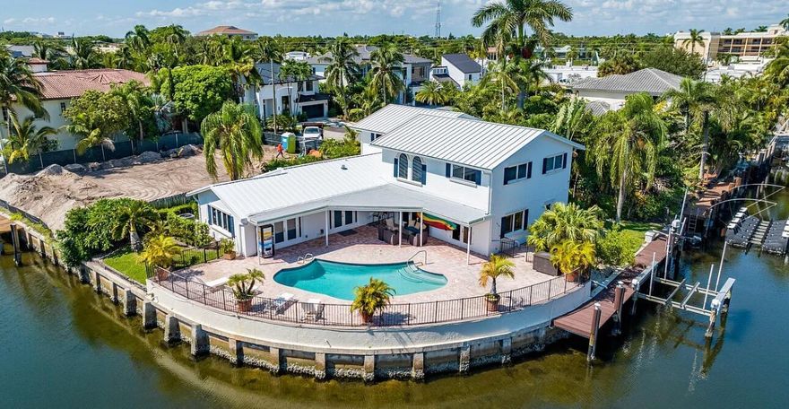 This STUNNING 4 Bed/3.5 Bath waterfront DREAM HOME is now available for sale! Located on a unique interior point lot, this newly renovated spacious home hosts beautiful one-of-a-kind views of multiple canals, has 165 feet of interior canal frontage, and a 55-foot dock with boat lift. Complete with impact glass windows, large entertainment area, newly renovated kitchen, brand new laundry room, a new CAT-6 internet installation, and a GORGEOUS master suite, this home is move-in ready!! Proposed plans  for a wrap around dock and a 2nd boat lift.(see documents)