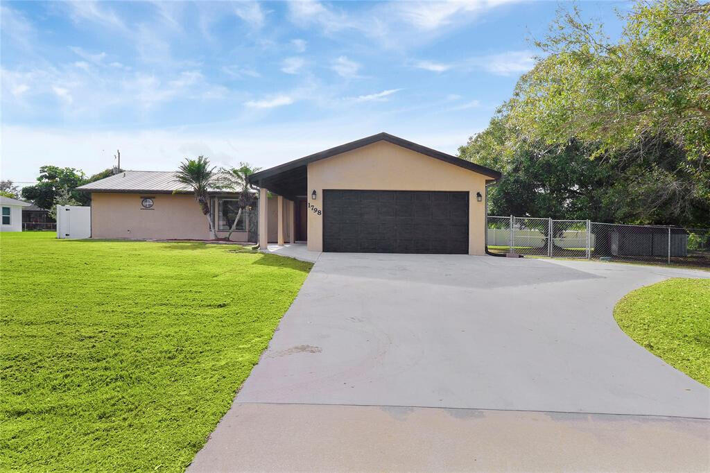 Photo of 1798 SW Del Rio Boulevard, Port Saint Lucie, FL 34953 (MLS # B26076817)