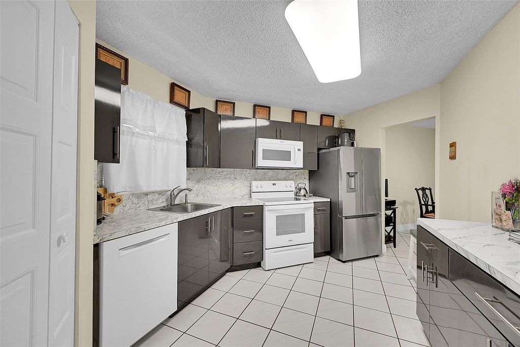 Photo of 6555 W Broward Blvd #303, Plantation, FL 33317 (MLS # F10529057)