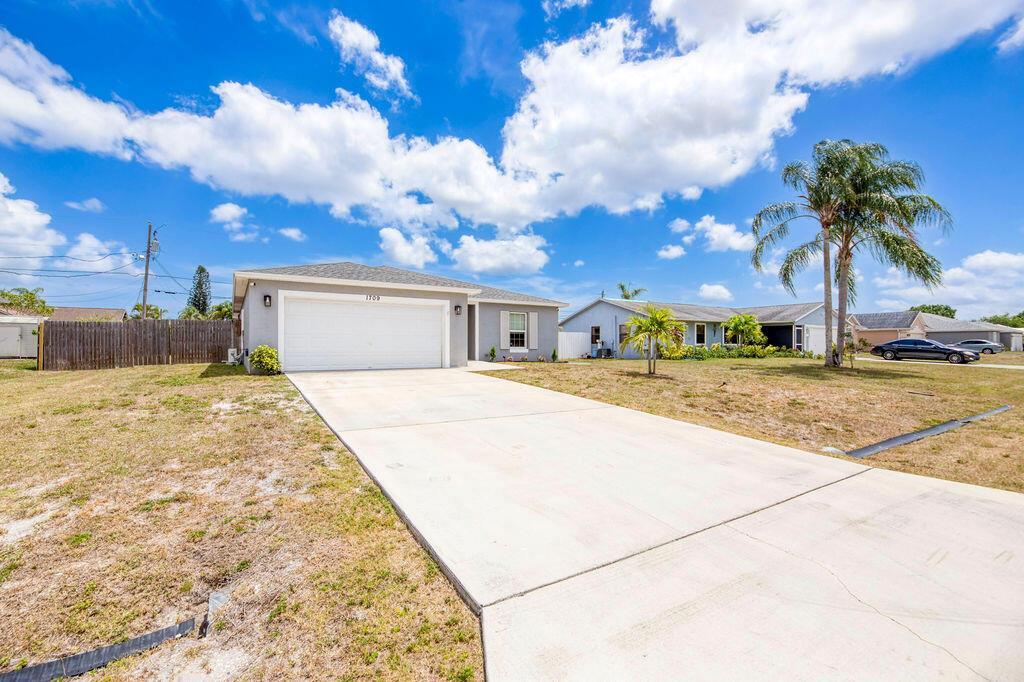 Photo of 1709 SW Monterrey Lane, Port Saint Lucie, FL 34953 (MLS # R11084989)