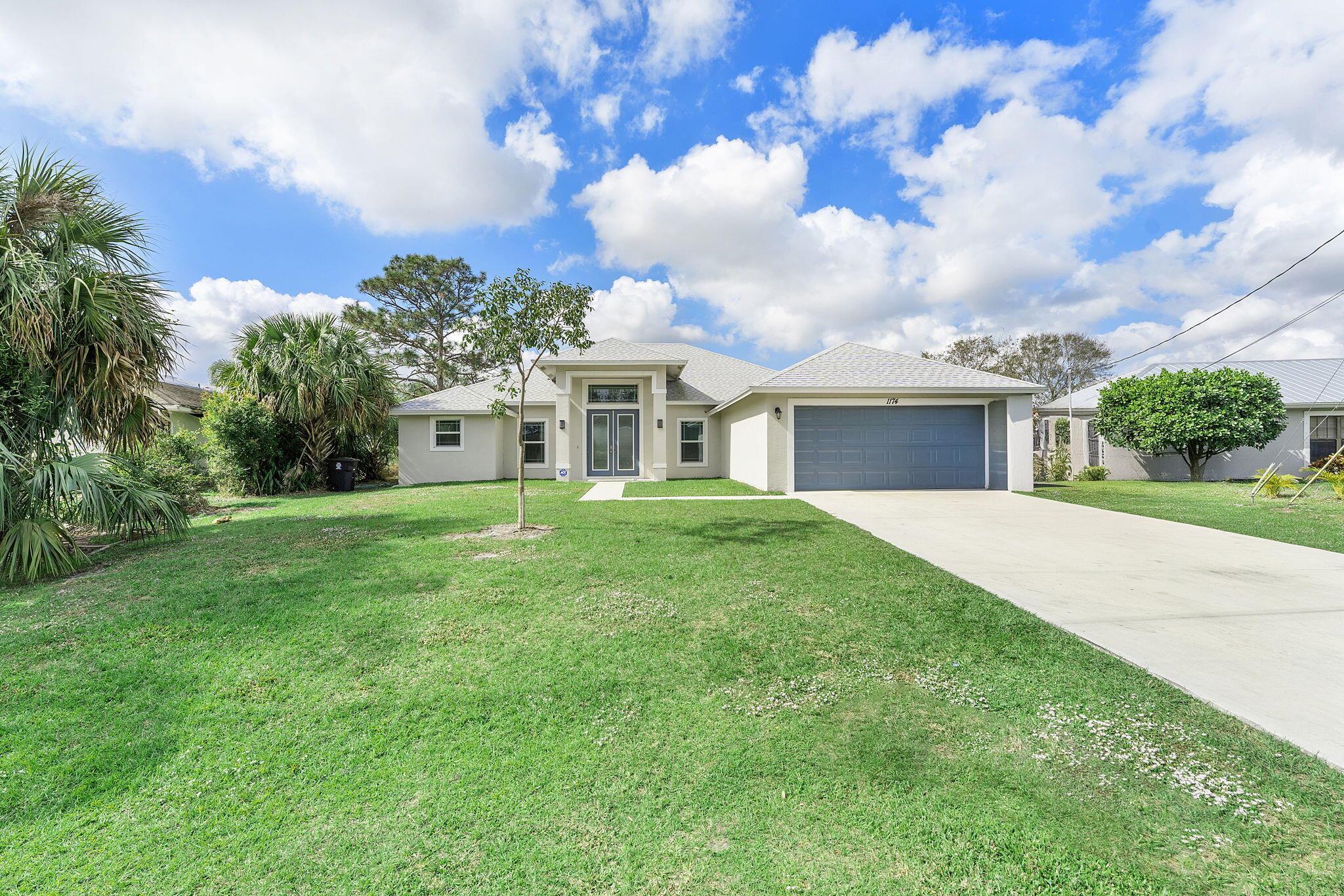 This beautiful home, built in 2023, offers 5 bedrooms, 3 full bathrooms, a 2-car garage, and a refreshing pool. The striking single-story design features soaring ceilings and plenty of natural light, creating an inviting sense of spaciousness from the moment you walk in. The main living area boasts elegant, light-toned tile flooring and stylish lighting fixtures, including modern pendant lights and a gorgeous gold chandelier that add a touch of sophistication. The modern kitchen is a cook's delight, with soft-close white cabinets, gleaming granite countertops, and stainless steel appliances, all centered around a generous island with breakfast bar seating. The open-concept layout seamlessly connects the kitchen to both formal and casual dining areas, making it perfect for gatherings