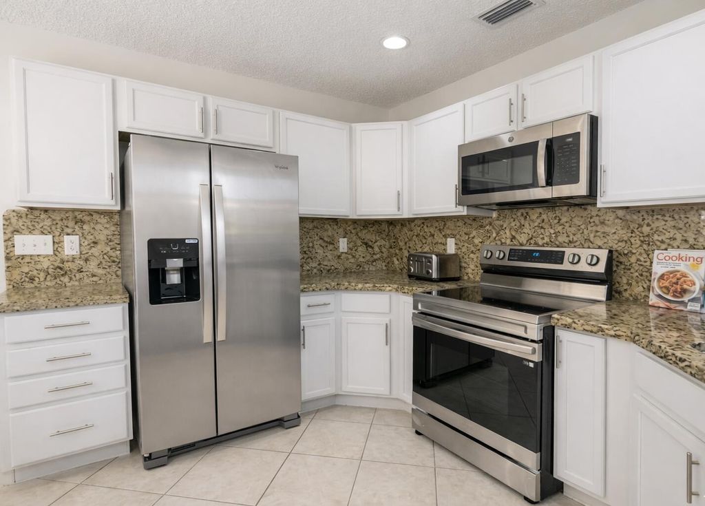 Photo of 703 Crosswinds Drive, Greenacres, FL 33413 (MLS # B26024497)